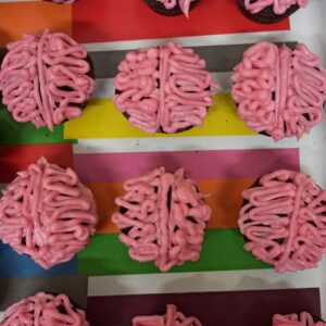 The lab team celebrates with brain cupcakes baked by Professor Vaidya