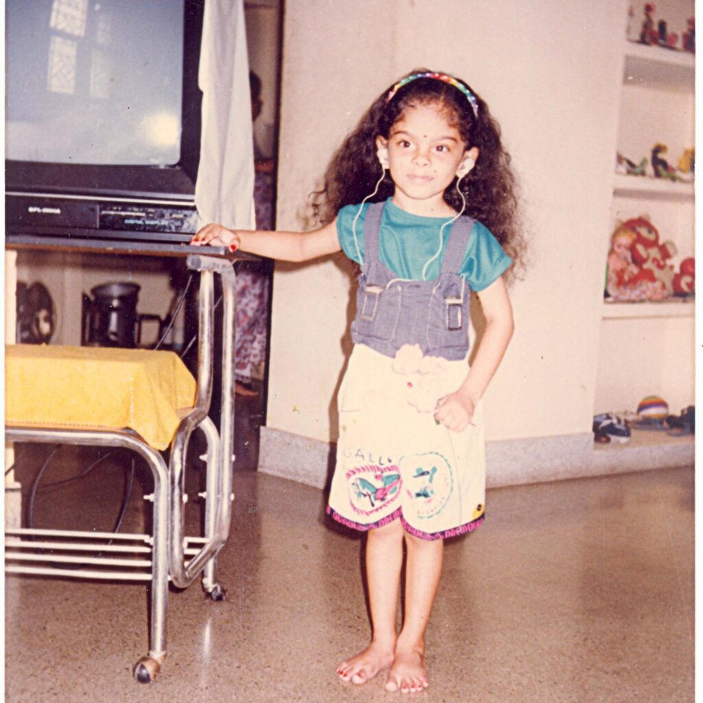 At Chennai, when Mahita was being trained in Balavidyalaya. She was wearing pocket hearing aids then. You can see them strapped to her chest, with wires connecting them to her ears.